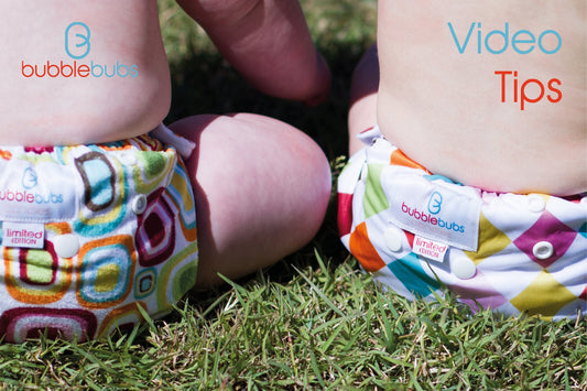 two-candy-cloth-nappies-on-babies-bum