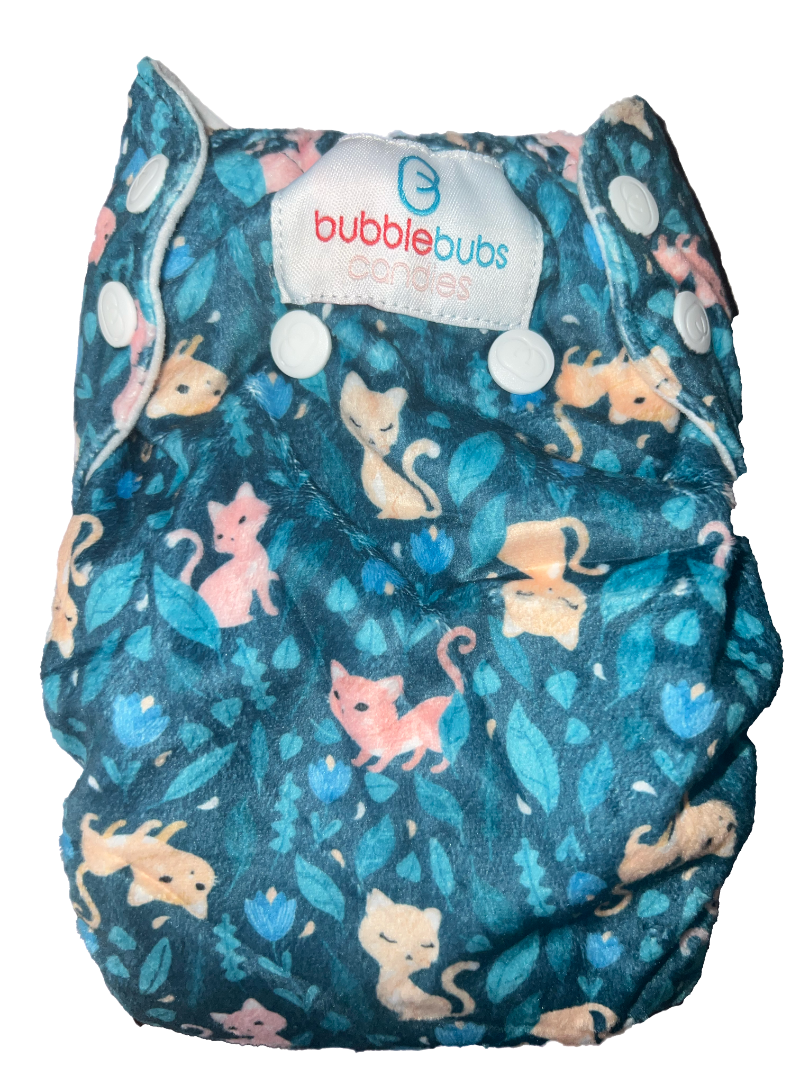 cats and flowers on the back of a candie cloth nappy