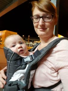 Mother taking selfie with baby in a carrier