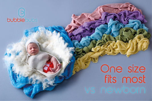 A-newborn-baby-sitting-on-a-rainbow-wearing-an-all-in-one-modern-cloth-nappy