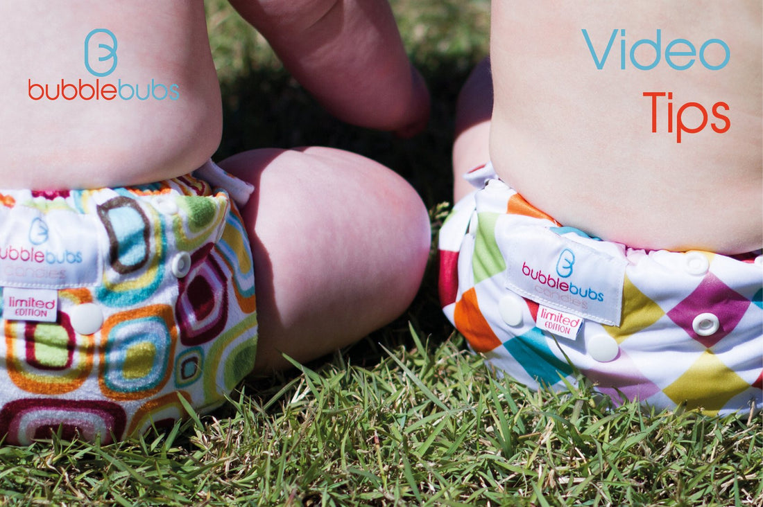 two-candy-cloth-nappies-on-babies-bum