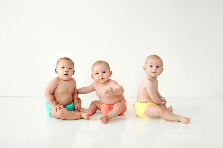 three babies waring candie cloth nappies