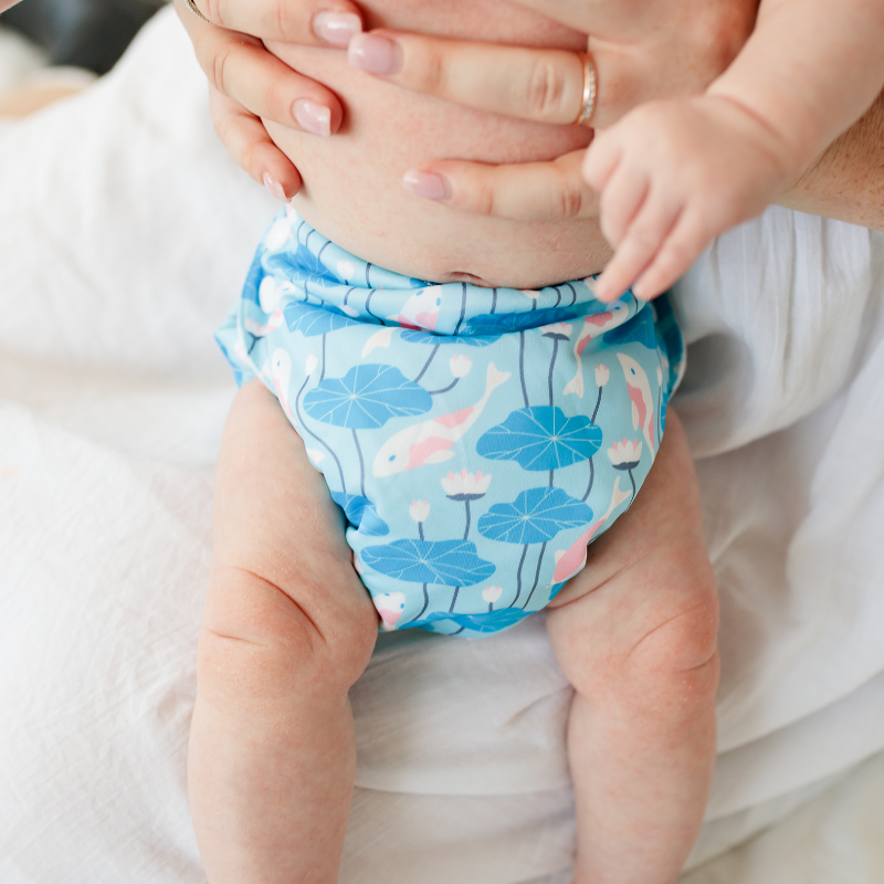 bopeep cloth nappy on a baby in mothers arms