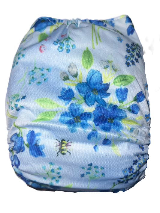 blue flowers and a bee on a candie cloth nappy