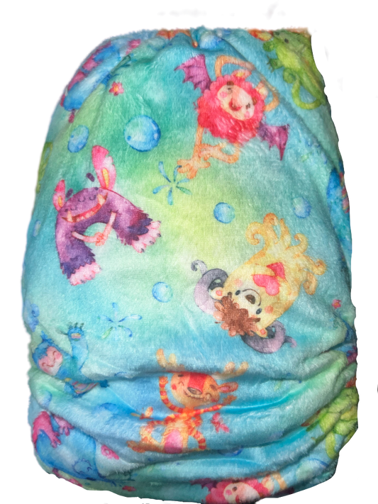 candie cloth nappy Namaste patten showing Bubblebubs logo and snaps